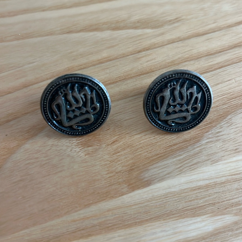Silver cuff links with Arabic design